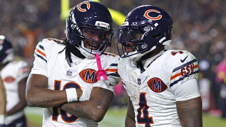 Oct 13, 2025; Landover, Maryland, USA; Chicago Bears running back D'Andre Swift (4) celebrates scoring a touchdown with Luther Burden III (10) during the fourth quarter against the Washington Commanders at Northwest Stadium.
