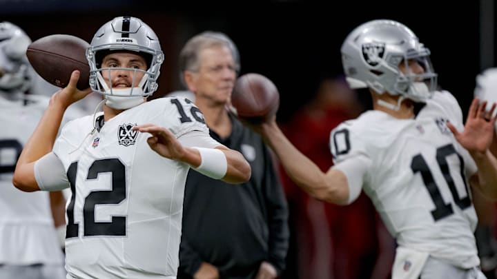 Dec 29, 2024; New Orleans, Louisiana, USA; Las Vegas Raiders quarterback Aidan O'Connell (12) throws before a game against the New Orleans Saints at Caesars Superdome. Mandatory Credit: Matthew Hinton-Imagn Images