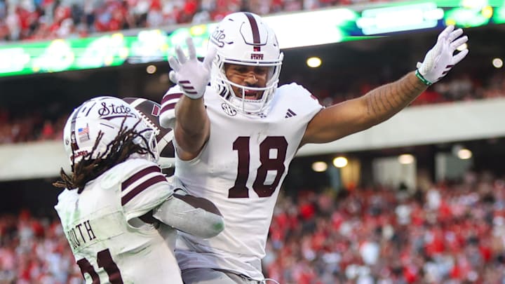Mississippi State Bulldogs running back Davon Booth (21) celebrates after a touchdown with tight end Seydou Traore (18) against the Georgia Bulldogs in the third quarter at Sanford Stadium. Mississippi State Bulldogs running back Davon Booth (21) celebrates after a touchdown with tight end Seydou Traore (18) against the Georgia Bulldogs in the third quarter at Sanford Stadium.