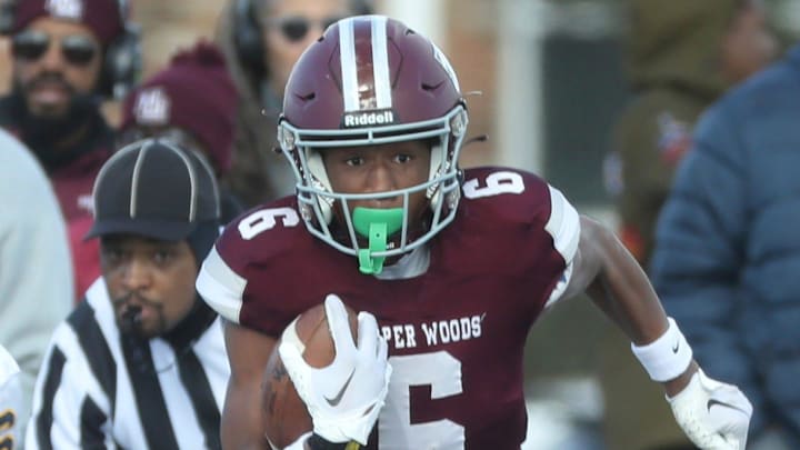 Harper Woods receiver Dakota Guerrant runs by Airport High School Colin Nowak for a touchdown during first half action at Harper Woods High School on Saturday, Nov 11, 2023.