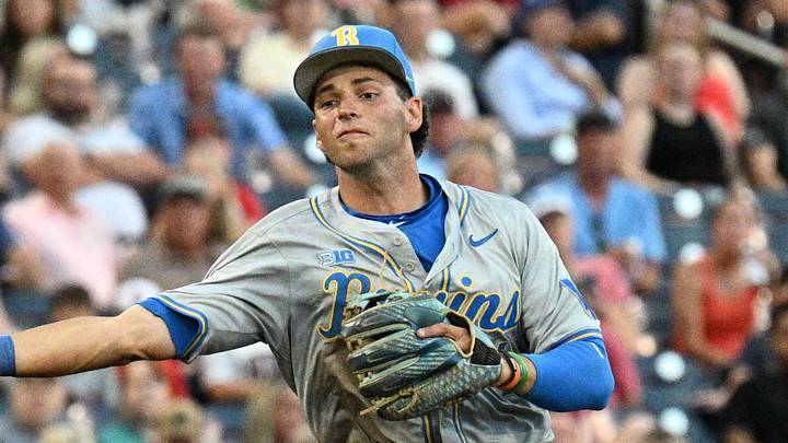 Jun 17, 2025; Omaha, Neb, USA;  UCLA Bruins shortstop Roch Cholowsky (1) throws to first base against the Arkansas Razorbacks during the third inning at Charles Schwab Field. Mandatory Credit: Steven Branscombe-Imagn Images