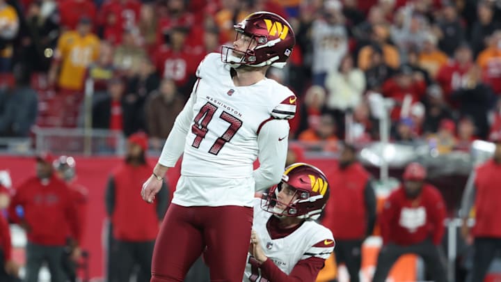 Jan 12, 2025; Tampa, Florida, USA; Washington Commanders place kicker Zane Gonzalez (47) kicks the game-winning field goal out of the hold of punter Tress Way (10) during the fourth quarter of a NFC wild card playoff against the Tampa Bay Buccaneers at Raymond James Stadium. Mandatory Credit: Kim Klement Neitzel-Imagn Images Jan 12, 2025; Tampa, Florida, USA; Washington Commanders place kicker Zane Gonzalez (47) kicks the game-winning field goal out of the hold of punter Tress Way (10) during the fourth quarter of a NFC wild card playoff against the Tampa Bay Buccaneers at Raymond James Stadium. Mandatory Credit: Kim Klement Neitzel-Imagn Images