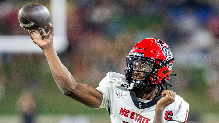 Sep 11, 2025; Winston-Salem, North Carolina, USA;  North Carolina State Wolfpack quarterback CJ Bailey (11) throws a pass in first half against the Wake Forest Demon Deacons at Allegacy Federal Credit Union Stadium. Mandatory Credit: Luke Jamroz-Imagn Images