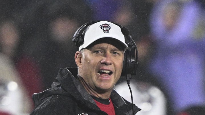 Dec 28, 2024; Annapolis, MD, USA; North Carolina State Wolfpack head coach Dave Doeren reacts after a play during the first half of the Go Bowling Military Bowl at Navy-Marine Corps Memorial Stadium. Mandatory Credit: Tommy Gilligan-Imagn Images Dec 28, 2024; Annapolis, MD, USA; North Carolina State Wolfpack head coach Dave Doeren reacts after a play during the first half of the Go Bowling Military Bowl at Navy-Marine Corps Memorial Stadium. Mandatory Credit: Tommy Gilligan-Imagn Images