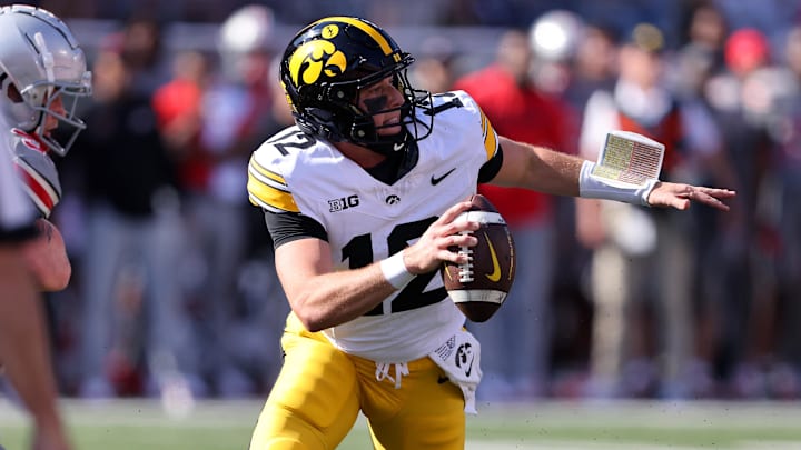 Oct 5, 2024; Columbus, Ohio, USA; Iowa Hawkeyes quarterback Cade McNamara (12) drops back to throw against the Ohio State Buckeyes during the first quarter at Ohio Stadium. Mandatory Credit: Joseph Maiorana-Imagn Images Oct 5, 2024; Columbus, Ohio, USA; Iowa Hawkeyes quarterback Cade McNamara (12) drops back to throw against the Ohio State Buckeyes during the first quarter at Ohio Stadium. Mandatory Credit: Joseph Maiorana-Imagn Images