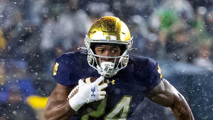 Notre Dame Fighting Irish running back Jadarian Price runs the ball against the Navy Midshipmen. Notre Dame Fighting Irish running back Jadarian Price runs the ball against the Navy Midshipmen.