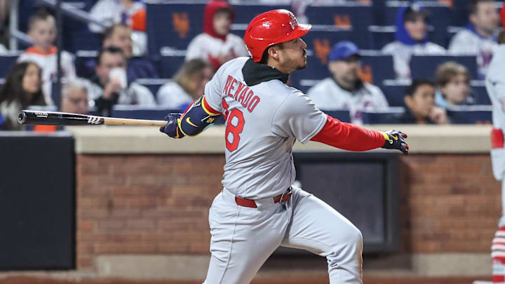 Apr 18, 2025; New York City, New York, USA;  St. Louis Cardinals third baseman Nolan Arenado (28) hits a RBI single in the sixth inning against the New York Mets at Citi Field. 