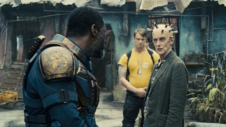 (L-r) IDRIS ELBA as Bloodsport, JOEL KINNAMAN as Colonel Rich Flag, and PETER CAPALDI as Thinker in Warner Bros. Pictures’ superhero action adventure “THE SUICIDE SQUAD,” a Warner Bros. Pictures release. Courtesy of Warner Bros. Pictures/™ & © DC Comics. © 2021 Warner Bros. Entertainment Inc. All Rights Reserved.