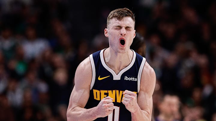 Jan 7, 2025; Denver, Colorado, USA; Denver Nuggets guard Christian Braun (0) reacts after a play in the fourth quarter against the Boston Celtics at Ball Arena. Mandatory Credit: Isaiah J. Downing-Imagn Images