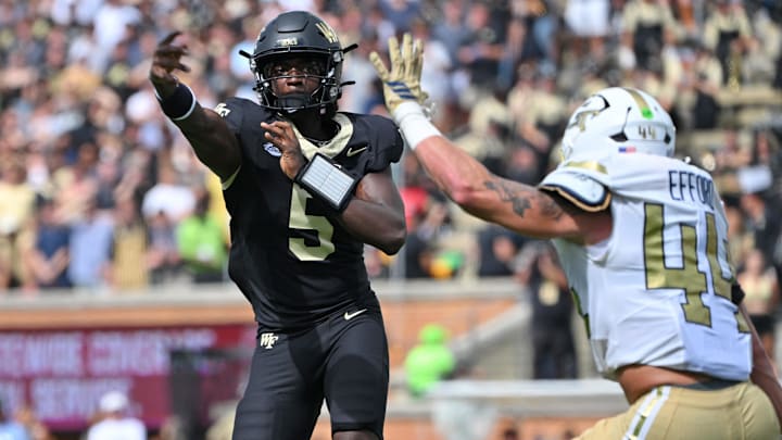 Sep 27, 2025; Winston-Salem, North Carolina, USA; Wake Forest Demon Deacons quarterback Deshawn Purdie (5) throws a pass during the third quarter against the Georgia Tech Yellow Jackets at Allegacy Federal Credit Union Stadium. Mandatory Credit: Zachary Taft-Imagn Images Sep 27, 2025; Winston-Salem, North Carolina, USA; Wake Forest Demon Deacons quarterback Deshawn Purdie (5) throws a pass during the third quarter against the Georgia Tech Yellow Jackets at Allegacy Federal Credit Union Stadium. Mandatory Credit: Zachary Taft-Imagn Images