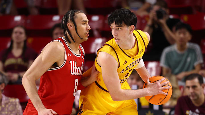 Feb 28, 2026; Tempe, Arizona, USA; Arizona State Sun Devils forward Santiago Trouet (1) controls the ball against Utah Utes forward Keanu Dawes (8) in the first half at Desert Financial Arena. Mandatory Credit: Mark J. Rebilas-Imagn Images