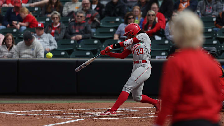 Nebraska third baseman Samantha Bland swings at a pitch Friday against Maryland.