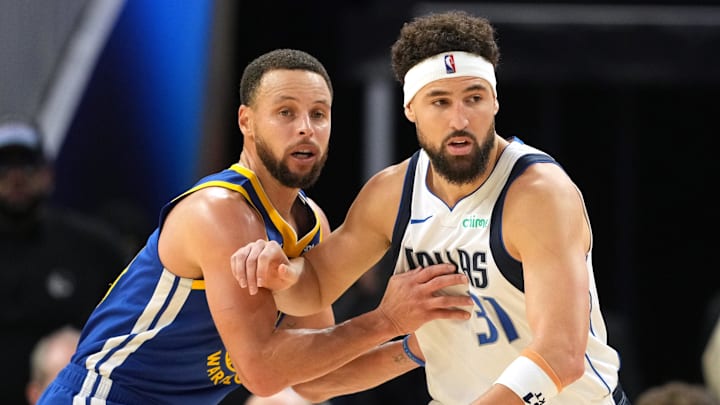 Dec 15, 2024; San Francisco, California, USA; Golden State Warriors guard Stephen Curry (left) defends against Dallas Mavericks guard Klay Thompson (31) during the fourth quarter at Chase Center. Mandatory Credit: Darren Yamashita-Imagn Images