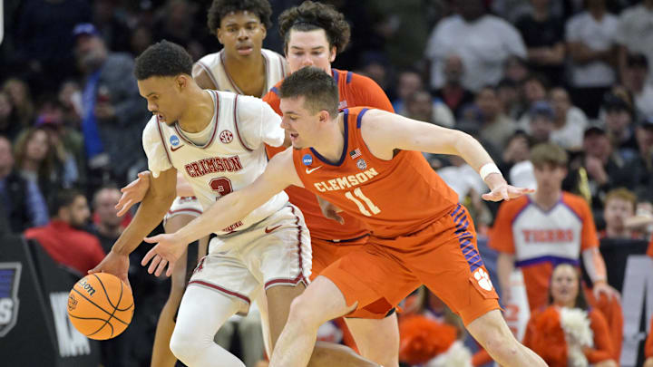 Mar 30, 2024; Los Angeles, CA, USA; Alabama Crimson Tide guard Rylan Griffen (3) controls the ball against Clemson Tigers guard Joseph Girard III (11) in the second half in the finals of the West Regional of the 2024 NCAA Tournament at Crypto.com Arena. Mandatory Credit: Jayne Kamin-Oncea-Imagn Images