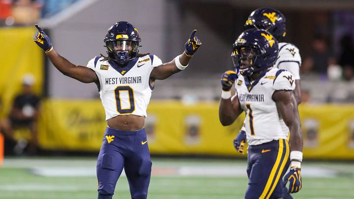 Sep 19, 2026; Charlotte, North Carolina, USA; West Virginia Mountaineers safety Andrew Powdrell (0) celebrates a defensive stop during the first quarter against the Virginia Cavaliers at Bank of America Stadium. Mandatory Credit: Ben Queen-Imagn Images Sep 19, 2026; Charlotte, North Carolina, USA; West Virginia Mountaineers safety Andrew Powdrell (0) celebrates a defensive stop during the first quarter against the Virginia Cavaliers at Bank of America Stadium. Mandatory Credit: Ben Queen-Imagn Images