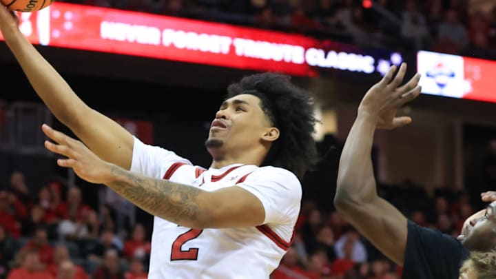 Dec 21, 2024; Newark, New Jersey, USA; Rutgers Scarlet Knights guard Dylan Harper (2) shoots the ball while being defended by Princeton Tigers guard Dalen Davis (22) and guard Blake Peters (24) during the first half at Prudential Center. Mandatory Credit: Tom Horak-Imagn Images Dec 21, 2024; Newark, New Jersey, USA; Rutgers Scarlet Knights guard Dylan Harper (2) shoots the ball while being defended by Princeton Tigers guard Dalen Davis (22) and guard Blake Peters (24) during the first half at Prudential Center. Mandatory Credit: Tom Horak-Imagn Images