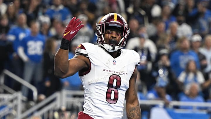 Washington Commanders running back Brian Robinson Jr. celebrates a touchdown against Detroit Lions.