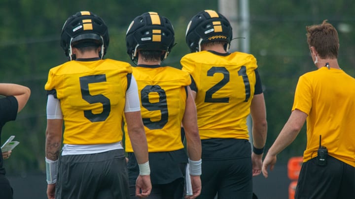 Aug 6, 2025; Columbia, MO, USA; Missouri Tigers quarterbacks Matt Zollers (5), Beau Pribula (9) and Sam Horn (21) walk back during a drill during fall camp at Mizzou Athletic Training Complex.