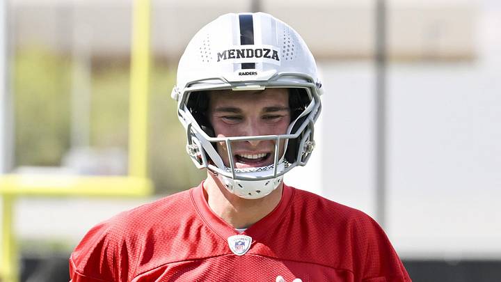 Las Vegas Raiders quarterback Fernando Mendoza warms up during organized team activities.