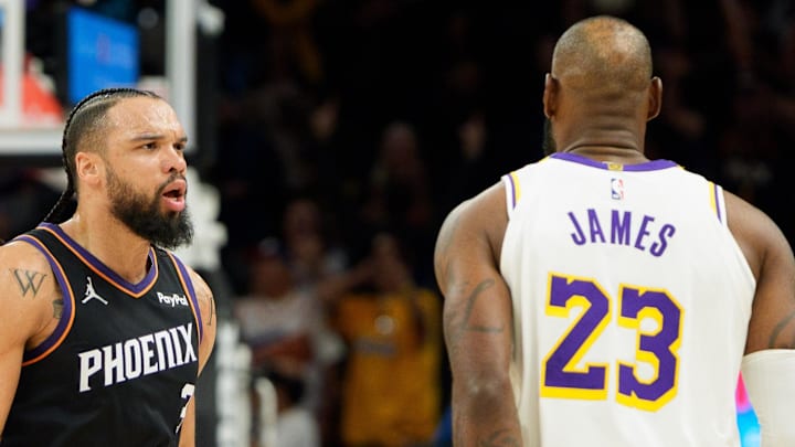 Dec 14, 2025; Phoenix, Arizona, USA; Phoenix Suns forward Dillon Brooks (3) and Los Angeles Lakers forward LeBron James (23) react during an altercation that resulted in a technical for Brooks during the second half of a game at at Mortgage Matchup Center. Mandatory Credit: Allan Henry-Imagn Images