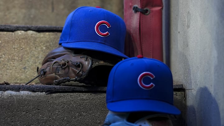 Chicago player hats are seen on the dugout steps