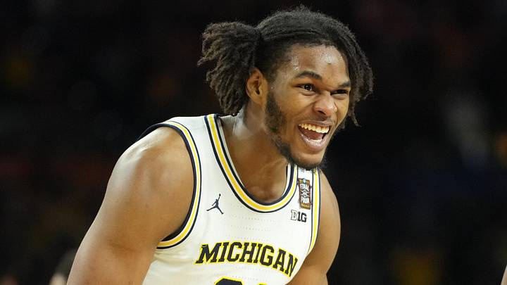 Apr 6, 2026; Indianapolis, IN, USA; Michigan Wolverines forward Morez Johnson Jr. (21) celebrates after defeating the Connecticut Huskies in the national championship of the Final Four of the men's 2026 NCAA Tournament at Lucas Oil Stadium. Mandatory Credit: Robert Deutsch-Imagn Images