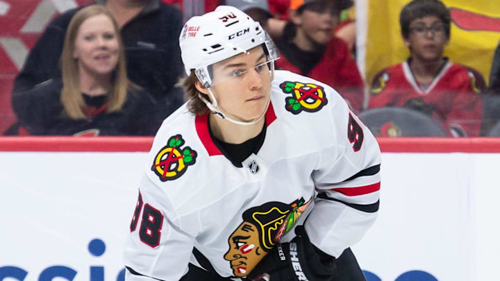 Apr 15, 2025; Ottawa, Ontario, CAN; Chicago Blackhawks center Connor Bedard (98) controls the puck in the second period against the Ottawa Senators at the Canadian Tire Centre. Mandatory Credit: Marc DesRosiers-Imagn Images