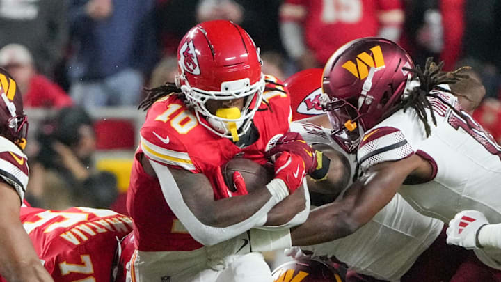 Oct 27, 2025; Kansas City, Missouri, USA; Kansas City Chiefs running back Isiah Pacheco (10) carries the ball against the Washington Commanders during the second quarter of the game at GEHA Field at Arrowhead Stadium. Mandatory Credit: Denny Medley-Imagn Images