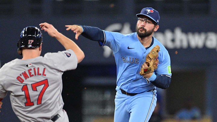 Sep 24, 2024; Toronto, Ontario, CAN;  Toronto Blue Jays second baseman Davis Schneider (36) throws to first base for a double play after forcing out Boston Red Sox pinch runner Tyler O'Neill (17) in the ninth inning at Rogers Centre. Mandatory Credit: Dan Hamilton-Imagn Images