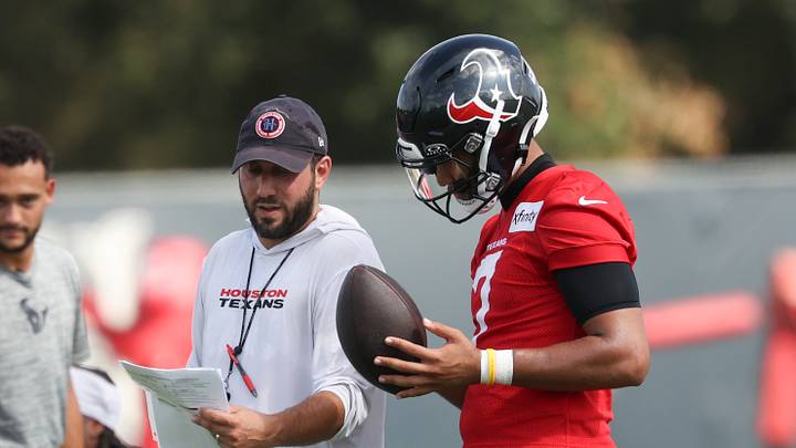 Houston Texans offensive coordinator Nick Caley talks with quarterback C.J. Stroud (7) Houston Texans offensive coordinator Nick Caley talks with quarterback C.J. Stroud (7)