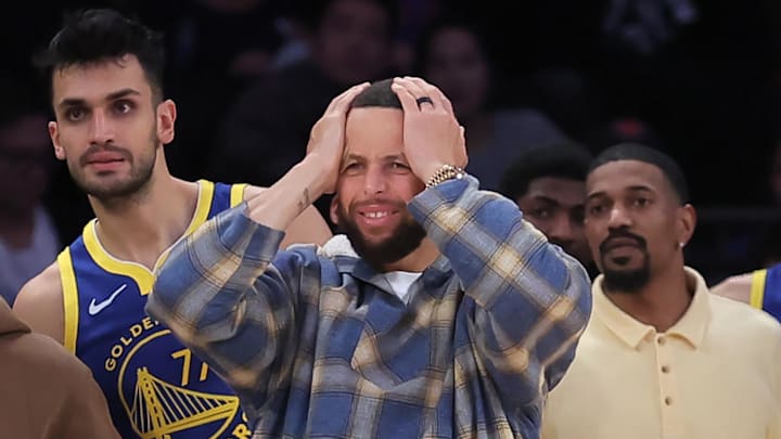 Mar 15, 2026; New York, New York, USA; Golden State Warriors guards Seth Curry (31) and Stephen Curry (30) react from the bench during the fourth quarter against the New York Knicks at Madison Square Garden. Mandatory Credit: Brad Penner-Imagn Images