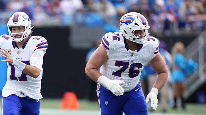 Oct 26, 2025; Charlotte, North Carolina, USA; Buffalo Bills guard David Edwards (76) blocks for quarterback Josh Allen (17) against the Carolina Panthers at Bank of America Stadium.