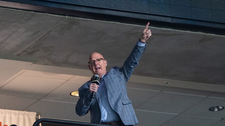 Apr 15, 2025; Saint Paul, Minnesota, USA; The Minnesota Gophers head coach Bob Motzko leads the crowd in a “Let’s play hockey” cheer before the game between the Minnesota Wild and Anaheim Ducks at Xcel Energy Center. Mandatory Credit: Matt Blewett-Imagn Images