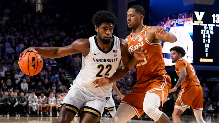 Texas Longhorns forward Jayson Kent (25) guards Vanderbilt Commodores forward Jaylen Carey (22) during the first half at Memorial Gymnasium. 
