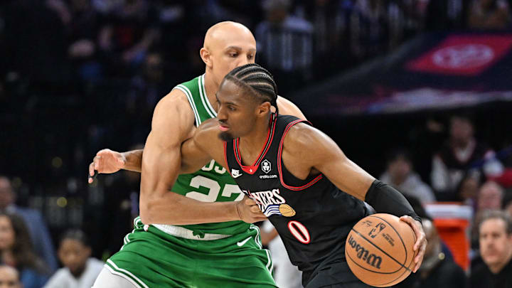 Apr 24, 2026; Philadelphia, Pennsylvania, USA; Philadelphia 76ers guard Tyrese Maxey (0) is defended by Boston Celtics guard Jordan Walsh (27) during the first half at Xfinity Mobile Arena. Mandatory Credit: Eric Hartline-Imagn Images