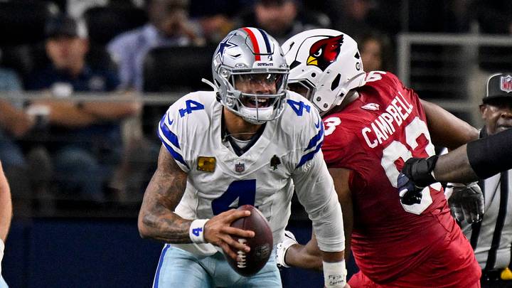 Dallas Cowboys quarterback Dak Prescott runs with the ball during the game against the Arizona Cardinals at AT&T Stadium. Dallas Cowboys quarterback Dak Prescott runs with the ball during the game against the Arizona Cardinals at AT&T Stadium.