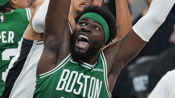 Mar 10, 2026; San Antonio, Texas, USA;  San Antonio Spurs forward Victor Wembanyama (1) shoots the ball against Boston Celtics center Neemias Queta (88) and guard Ron Haper Jr. (13) in the first half at Frost Bank Center. Mandatory Credit: Daniel Dunn-Imagn Images