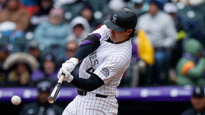Colorado Rockies first baseman Michael Toglia (4) hits a single