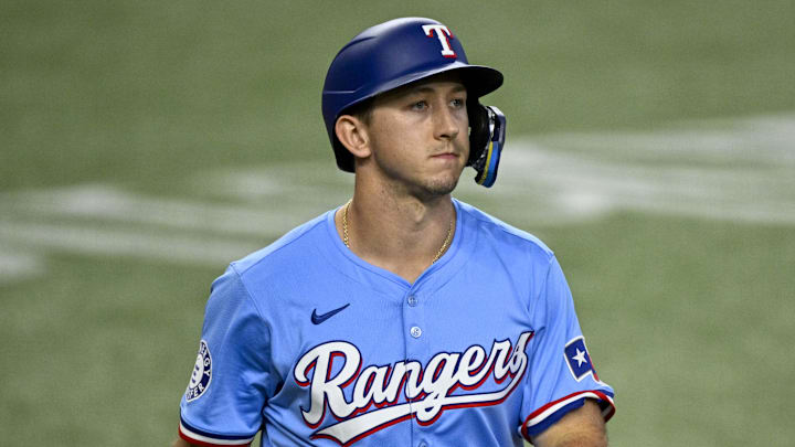 Sep 22, 2024; Arlington, Texas, USA; Texas Rangers left fielder Wyatt Langford (36) walks back to the dugout after he strikes out during the fourth inning against the Seattle Mariners at Globe Life Field