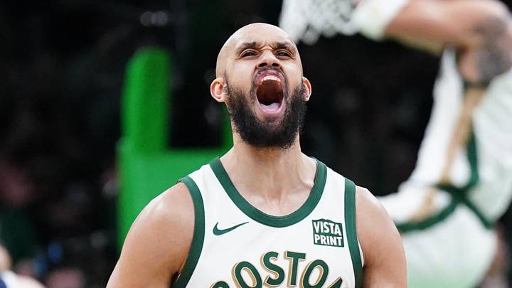 Boston Celtics guard Derrick White (9) reacts after forward Jayson Tatum (0) makes the basket against the Denver Nuggets in the second quarter at TD Garden on January 19, 2024.