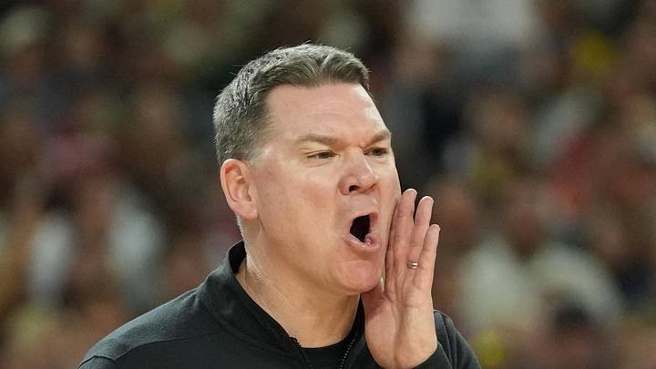 Apr 4, 2026; Indianapolis, IN, USA;  Arizona Wildcats head coach Tommy Lloyd reacts against the Michigan Wolverines in the first half during a semifinal of the Final Four of the men's 2026 NCAA Tournament at Lucas Oil Stadium. Mandatory Credit: Robert Deutsch-Imagn Images