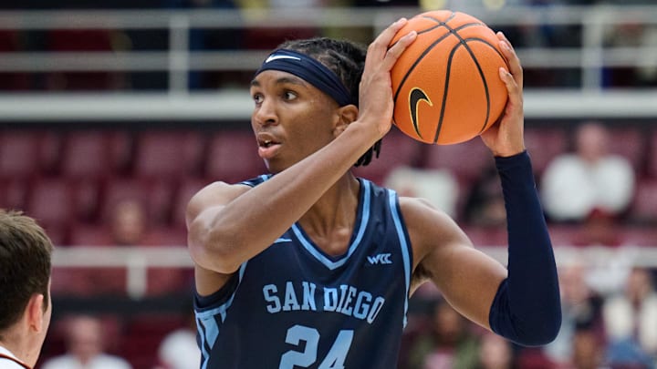 Dec 3, 2023; Stanford, California, USA; San Diego Toreros center Steven Jamerson II (24) looks to pass the ball against Stanford Cardinal forward Maxime Raynaud (42) during the second half at Maples Pavilion. Mandatory Credit: Robert Edwards-Imagn Images Dec 3, 2023; Stanford, California, USA; San Diego Toreros center Steven Jamerson II (24) looks to pass the ball against Stanford Cardinal forward Maxime Raynaud (42) during the second half at Maples Pavilion. Mandatory Credit: Robert Edwards-Imagn Images