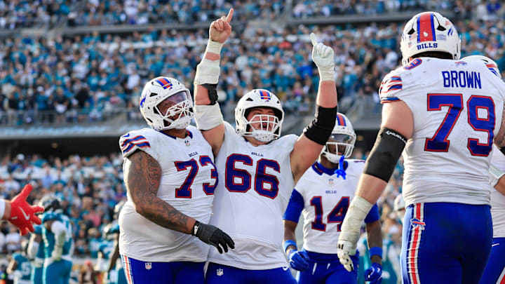 Buffalo Bills center Connor McGovern celebrates a touchdown from Buffalo Bills quarterback Josh Allen.