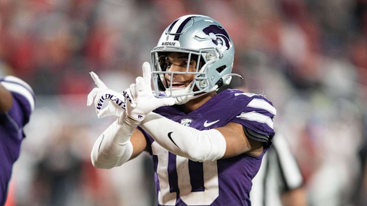 Dec 28, 2023; Orlando, FL, USA; Kansas State cornerback Jacob Parrish (10) celebrates an interception against NC State in the fourth quarter at Camping World Stadium. Mandatory Credit: Jeremy Reper-Imagn Images Dec 28, 2023; Orlando, FL, USA; Kansas State cornerback Jacob Parrish (10) celebrates an interception against NC State in the fourth quarter at Camping World Stadium. Mandatory Credit: Jeremy Reper-Imagn Images