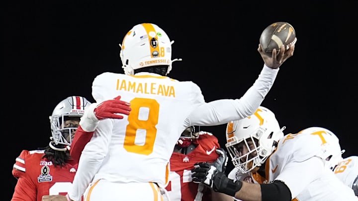 Dec 21, 2024; Columbus, Ohio, USA; Ohio State Buckeyes defensive end Kenyatta Jackson Jr. (97) hits Tennessee Volunteers quarterback Nico Iamaleava (8) during the first half of a College Football Playoff first round game at Ohio Stadium.