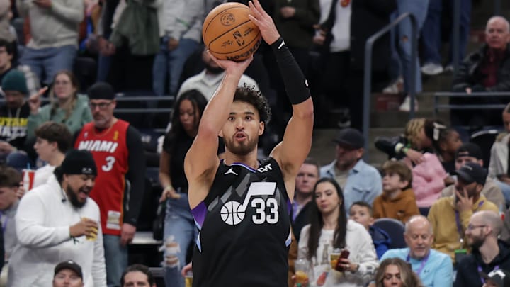 Jan 9, 2025; Salt Lake City, Utah, USA;  Utah Jazz guard Johnny Juzang (33) shoots an open jump shot against the Miami Heat during the second half at Delta Center. Mandatory Credit: Chris Nicoll-Imagn Images