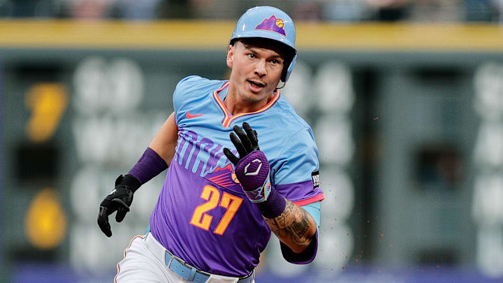 Jul 18, 2025; Denver, Colorado, USA; Colorado Rockies left fielder Jordan Beck (27) runs to third on an RBI triple in the first inning against the Minnesota Twins at Coors Field