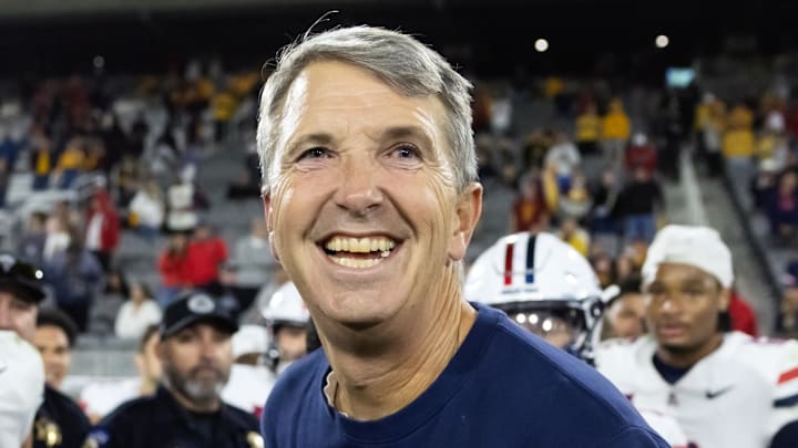 Nov 28, 2025; Tempe, Arizona, USA; Arizona Wildcats head coach Brent Brennan celebrates against the Arizona State Sun Devils during the 99th Territorial Cup at Mountain America Stadium. Mandatory Credit: Mark J. Rebilas-Imagn Images