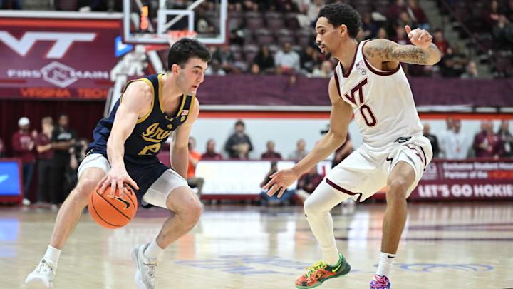 Jan 17, 2026; Blacksburg, Va.; Notre Dame guard Logan Imes (2) handles the ball as Virginia Tech guard Jailen Bedford (0) defends.