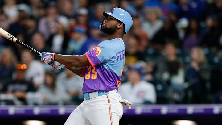 Aug 29, 2025; Denver, Colorado, USA; Colorado Rockies designated hitter Yanquiel Fernandez (35) watches his ball on a two run home run in the fourth inning against the Chicago Cubs at Coors Field. Mandatory Credit: Isaiah J. Downing-Imagn Images
